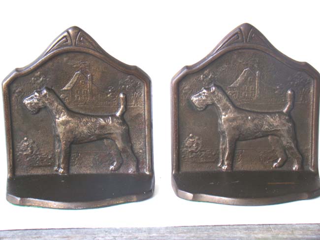 A pair of Antique Bookends circa 1929 depicting a Wire Haired Fox Terrier